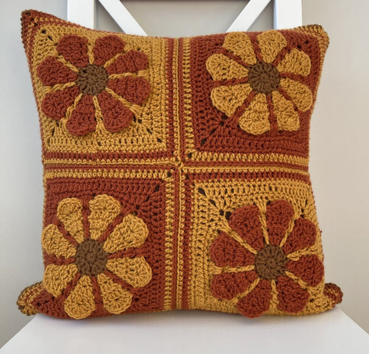 just cushions square crochet cushion with retro daisy pattern in autumn colours 